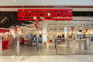 Americanas (AMER3) negocia acordo bilionário com principais bancos. Banco Safra busca adiar assembleia alegando falta de informações financeiras completas.