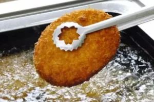 Imagem do Croquete de bife kobe sendo assado