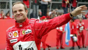 Rubens Barrichello em uniforme da Ferrari, um dos maiores pilotos brasileiros e destaque na Fórmula 1. Quanto ganha Rubens Barrichello?