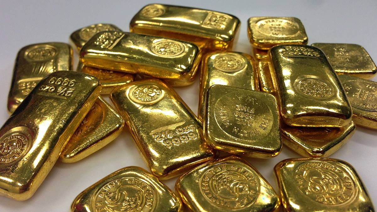 Imagem com ouro em barra. Preço do ouro pode valorizar até 14% em 2025