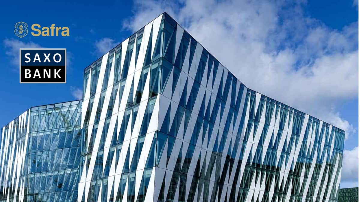 Fachada moderna do Saxo Bank após aquisição pelo Grupo Safra, marcando a expansão da instituição no mercado global de investimentos."