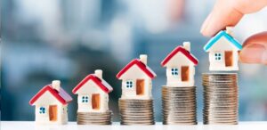 A imagem mostra várias casas para representar a MRV (MRVE3)