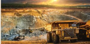 A imagem mostra uma mineradora para representar a produção de minério de ferro.