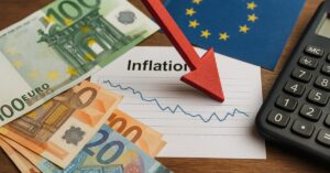 Gráfico e euro representam a inflação na zona do euro em maio de 2025