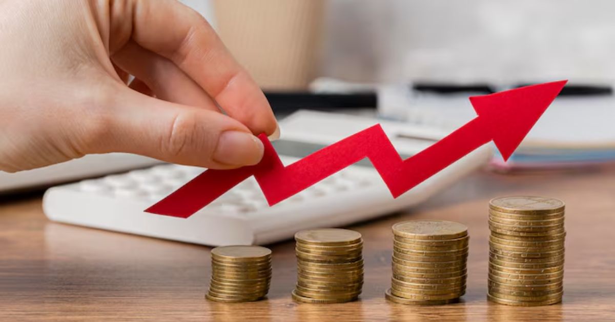 Gráfico simbólico mostra avanço do ICC do FGV IBRE com moedas e seta de alta.